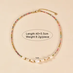 Colorful glass bead and pearl choker necklace detail, handmade style with golden extension chain.