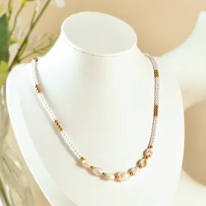 Handmade pearl choker necklace with gold metallic beads and white seed beads, elegant jewelry.