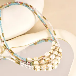Handmade multi-strand beaded necklace with freshwater pearls and colorful crystals, elegant gift.