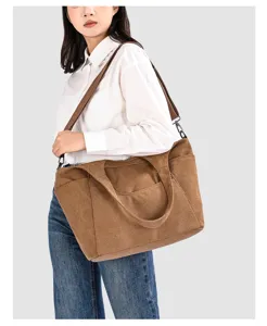 Vintage canvas shoulder bag for women, casual large capacity tote bag with pockets.