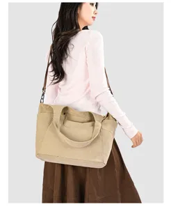 Detail view of this casual canvas shoulder bag, showing its large capacity and versatile wear.