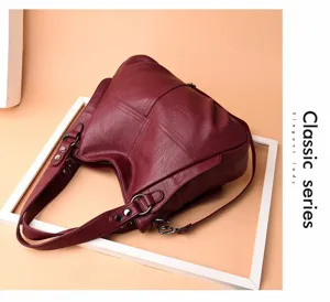 Wine red soft leather shoulder bag for women, stylish crossbody handbag with metal hardware.