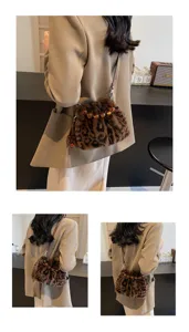 Detailed view of the chic leopard print plush shoulder bucket bag featuring amber beads.
