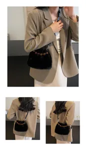 Stylish black plush crossbody bucket bag featuring elegant beaded handle for autumn and winter.