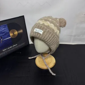 Detail shot of Fair Isle vintage bear ear knit hat, cute wool warm earflap hat for women.