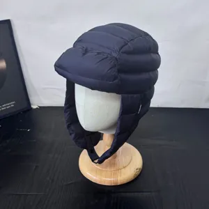 Winter warm windproof down trapper hat detail shot, thick padded bomber hat for outdoor skiing.