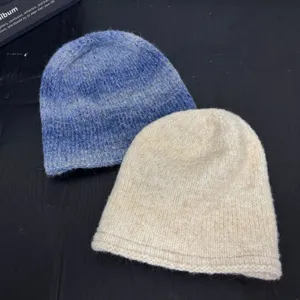 Slouchy knitted beanie hat for women, soft warm winter pull-on cap, cozy casual daily wear.