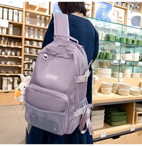 Zaino scolastico viola casual con tasche multiple e grazioso ciondolo coniglio per studenti.
