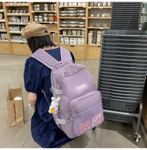 Zaino casual viola chiaro per studenti, borsa scolastica multifunzionale con ciondolo.
