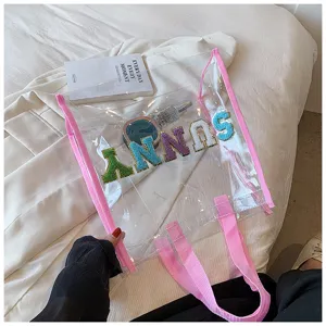 Transparente PVC Strandtasche mit rosa Rand, große Tragetasche für Sommerurlaub und den Alltag.