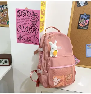 Zaino scolastico rosa in tela con ciondolo coniglio carino, zaino casual per studenti.