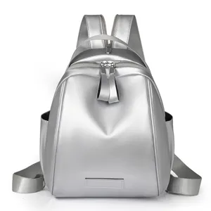 Stylish silver shell backpack for women, multi-purpose casual travel daypack bag.