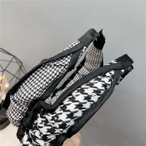 Classic black and white houndstooth hair hoop with elegant ruffled edge for women daily wear.