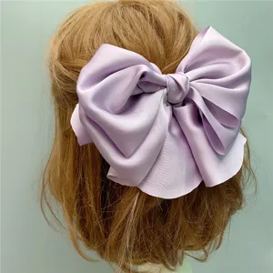 Lavender satin bow hair clip for women, elegant large hair accessory for daily styling.