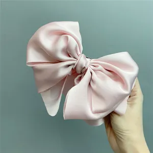 Pink satin big bow hair clip, elegant French style sweet hair accessory for women.