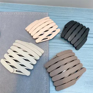 Expandable folding hair comb detail shot, multi-color portable magic hair accessory for women daily use.