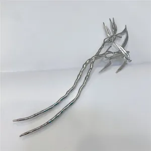 Detail shot of a silver leaf hairpin, showing the exquisite double-layer branch texture.