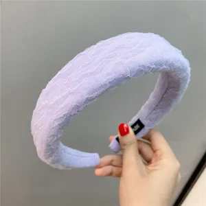 Detail view of the retro lavender bubble gauze sponge headband, wide brim solid color design.