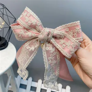 Sweet pink lace double bow hair clip with cute pendant detail, elegant hair accessory for women.