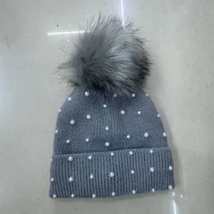 Grey knitted winter hat for women with pearls and large pom-pom, warm and thick beanie cap.