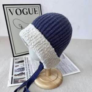 Winter warm knitted hat with plush brim and earflaps, stylish Korean style beanie for women.