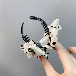 Sweet polka dot bow hair claw clip with pearl rhinestone charm for daily elegant hairstyles