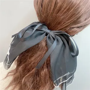 Large black chiffon hair bow clip with white ruffled edge, sweet elegant bowknot hair accessory.
