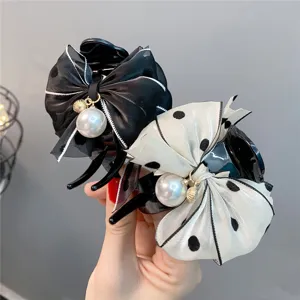 Sweet polka dot bow hair claw clip with pearl charm for cute daily hairstyles and ponytails.