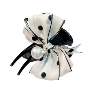 Elegant black and white polka dot bow hair claw clip with large pearl and crystal pendant.