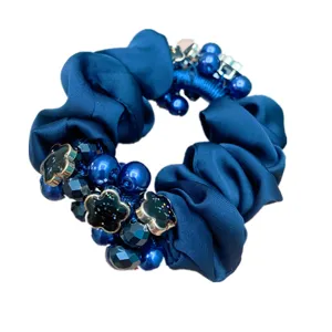 Blue satin hair scrunchie with pearls and clover charms for women elegant ponytail holder