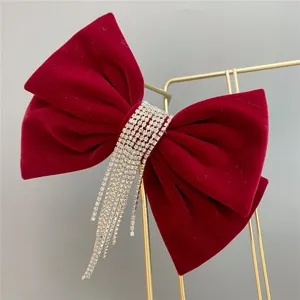 Red velvet bow hair clip with sparkling rhinestone fringe tassels, elegant bridal wedding headwear.
