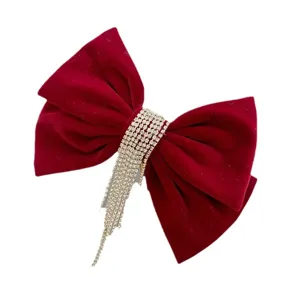 Red velvet hair bow clip with sparkling rhinestone fringe, perfect for bridal wedding and events.