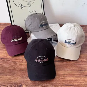 Detailed closeup of multi-color embroidered baseball caps featuring stylish front lettering.