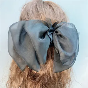 Black sheer organza oversized hair bow barrette, elegant three-layer bow hair clip for women.