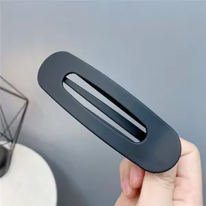Matte black geometric hollow hair clip, minimalist acrylic hairpin for daily styling and washing.