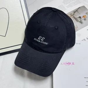 Classic black washed cotton baseball cap with embroidered lettering, casual sun hat for women and men