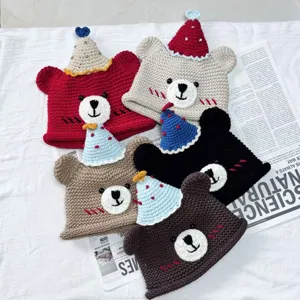 Handmade crochet bear hat with cute birthday party design, warm winter knit pullover cap gift.