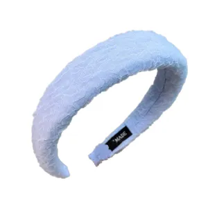 Light blue bubble gauze wide sponge headband detail shot, soft texture, solid color fashion hair accessory.