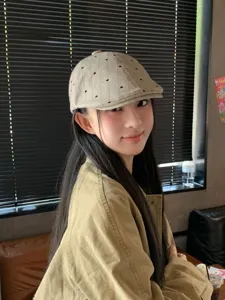 Detailed view of a retro Japanese heart embroidered flat cap, stylish newsboy hat for women.