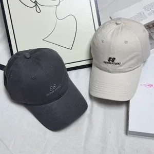 Washed cotton baseball cap for women and men, stylish letter embroidery sun hat.