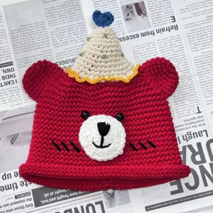 Handmade crochet bear beanie with cute party hat detail, cozy knit winter hat gift for best friends.