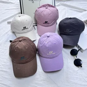 Casual washed cotton baseball cap with stylish letter embroidery for daily outdoor sun protection.