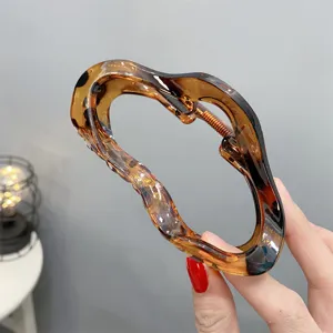 Acrylic cloud hair claw clip, leopard print jelly design, large elegant hair accessory for women.