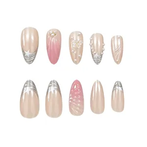 Long almond press-on nails with 3D relief, pearls, and stars. Perfect for chic manicures.
