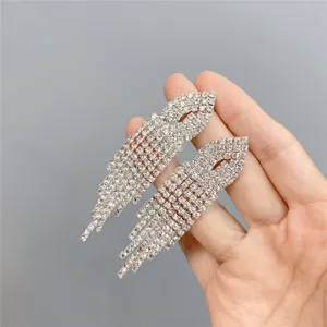 Long rhinestone tassel earrings for women, sparkling crystal feather design fashion jewelry.