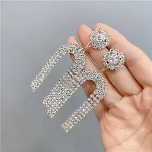 Exaggerated long rhinestone tassel earrings sparkling crystal drop design for party fashion.