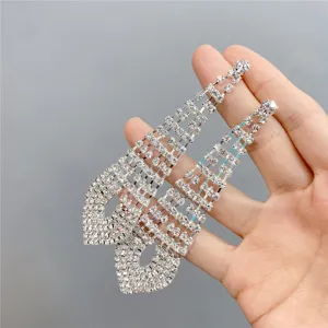 Long rhinestone fringe dangle earrings for women, sparkling crystal drop jewelry style.