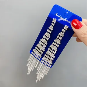 Long rhinestone fringe earrings detail view, sparkling crystal tassel drop design for women.