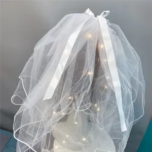 White double-layer mesh veil with fairy lights and white ribbon bow for hair decoration.