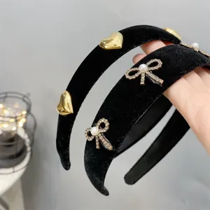 Black velvet headband set featuring metallic hearts and rhinestone pearl bows for women style.